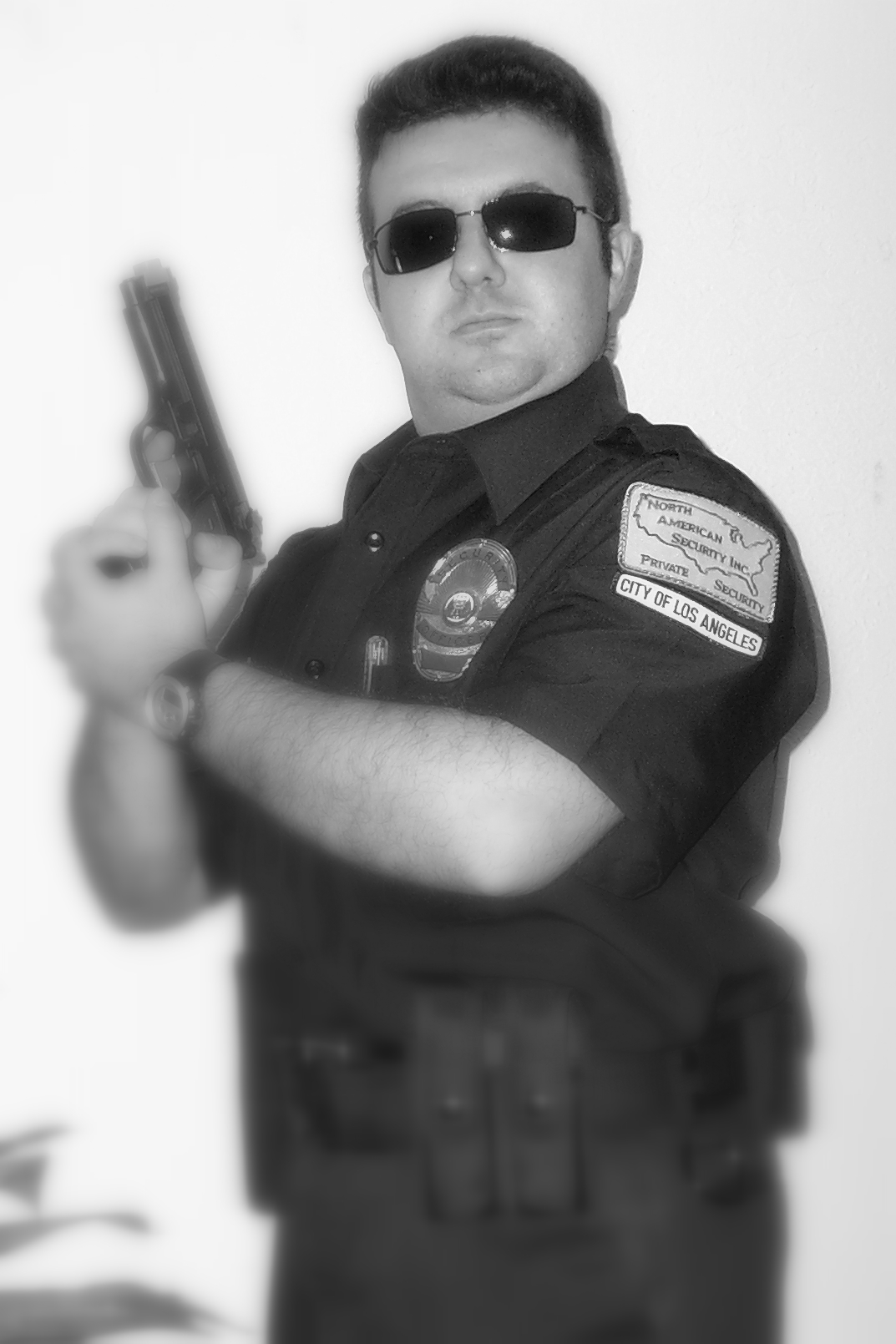 Private security guard in uniform carrying a sidearm